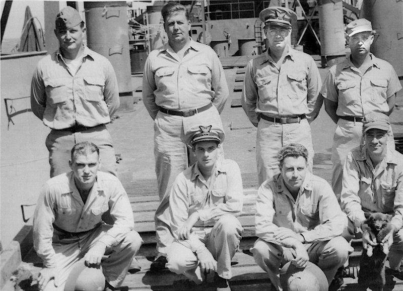 Officers 884.jpg - Ships Officers w/K9 mascotBack Row...Ens R. J. Vogelsang...Lt (jg) H. G. Baker...Lt (jg) L. B. Frye...Lt (jg) T. L. BectonFront Row...Ens A.M. Krumm...Lt (jg) S.R. Geist..Lt C.C. Pierson...Lt (jg) R.B. Day (Karl Krumm family photos)